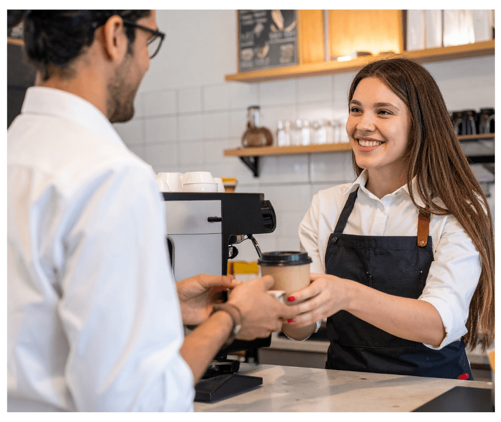 Happy coffee shop staff member